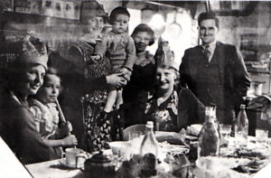 Christmas at Central Stores, Deighton, Yorkshire, in 1937. The writer can be seen sitting on her mother’s knee on the left