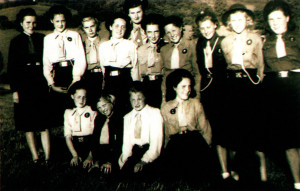 Left: Edna Brice stands in the middle of the back row with her wartime St.John’s Guide Company.