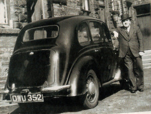 Dad poses proudly with his shiny black pre-war Austin before cramming everything into go to Swinderby in Lincolnshire.