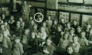 Now who hasn’t got their arms crossed? Little Ann Priest (ringed), sits at the back of the tiled classroom in 1945 where, typically, children were seated in pairs at solid wooden desks mounted on iron frames.