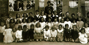 In this photograph of class lib at Huish Infants' School, Yeovil, when Dr. Hawkins was just six years old, he is seen second from left on the back row.