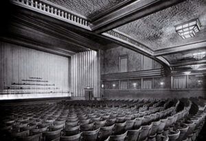 In the auditorium, downstairs. Each seat had its ashtray