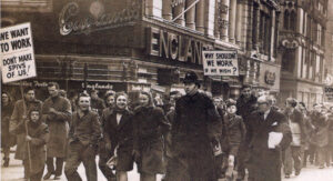 Youngsters protest in Colmore Row, Birmingham, in 1948 about not being allowed to work for normal wages after the age of 14. Compulsory school leaving age had just been raised to 15.