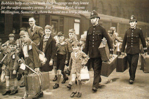 Bobbies help evacuees with their luggage as they leave for the safer country areas. For Terence Reid, it was Wellington, Somerset, where he went as a ten-year-old.