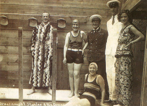 Dreadnought Stanley (left) in fetching gown with his Diving Belles - and his wife for just four years, Mercia, on the right, in a trouser suit remarkably fashionable for the Thirties!