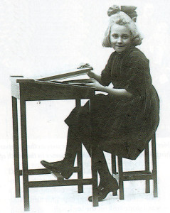 Little Gwen models the desk and stool her dad built that he hoped would be sold nationwide.