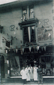 The writer’s father and the rest of his staff outside Chard Bros., Brixham, South Devon, during the Coronation celebrations of 1937.