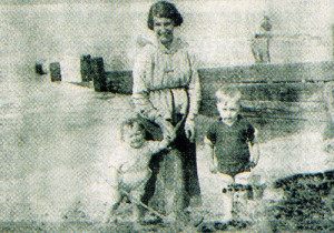 Peggy and her brother at the coast with their mother