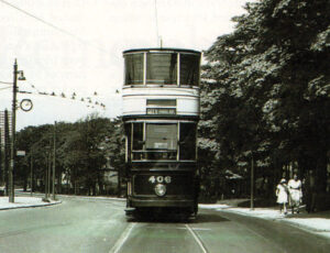 Showing ‘City (Angel St.)’ on its destination board, Sheffield tram No. 406 is seen at the top of Meadowshead on the kind of deserted roads that couldn't be imagined today.