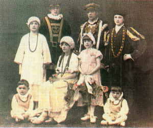 All seven brothers plus Kathleen (as waiting maid) dressed as characters in one of the operas put on by the Scouts and church choir in 1927.