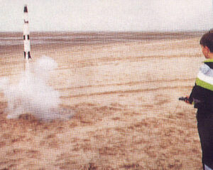 The author’s nephew launches a model rocket on Southport beach. With electric ignition and tracking these fly every time, unlike those of the early 1960s.