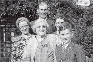 Three years after his ordeal, John Baker is pictured in the garden of the writer’s mother-in-law. From left are John’s mother, the grandma and mother of James Skinner’s wife. John’s father is at the back.