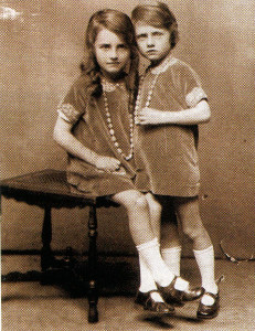 The writer (standing) and her sister in the late 1920s.