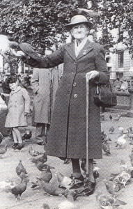 Mrs. Cox feeding the pigeons in Trafalgar Square just before the Second World War.