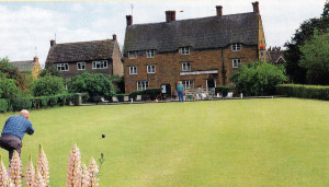 Bowls on a late summer's afternoon in front of the village pub, still sporting a Red Barrel sign! Can there be any-thing more British than this delightful, timeless scene in the Leicestershire village of Medbourne?