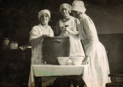 Pam's mother, standing in the centre, is pictured making puddings at Portsmouth's Eye and Ear Hospital where she worked as a kitchen maid.
